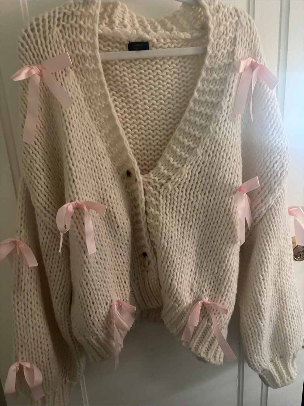 Cozy Cream Chunky Knit Cardigan with Pink Ribbon Detail
